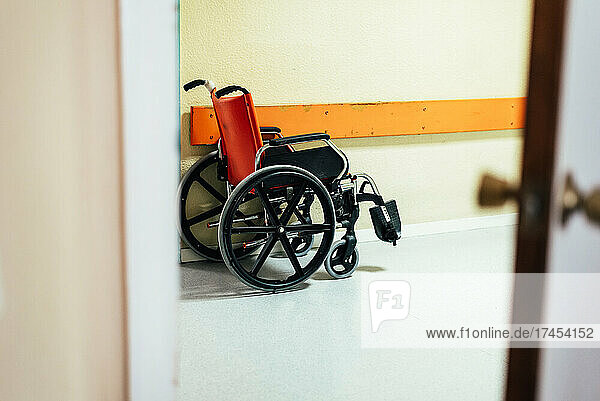 Wheelchair in a hospital corridor.