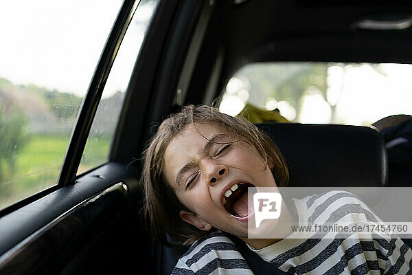 Kid screaming in car on the road trip