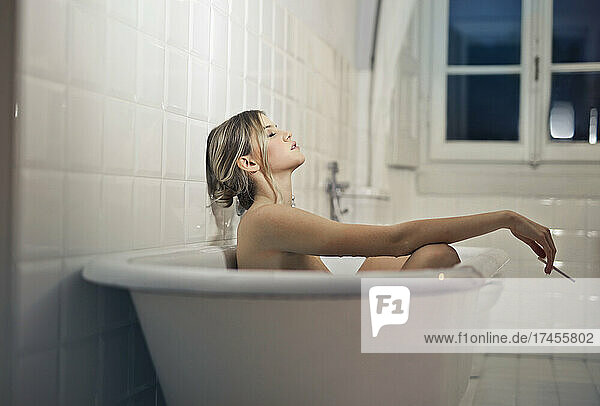 youn beautiful woman relaxed in bathtub