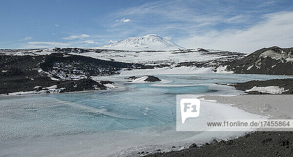 A frozen lake at Cape Royds  Antarctica with Mount Erebus behind