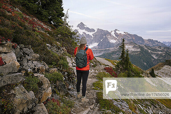 Female Hiker Taking Photo On A Trail In The North Cascades