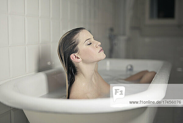 beautiful woman in a vintage bathtub
