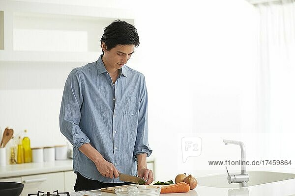 Japanese man cooking in the kitchen