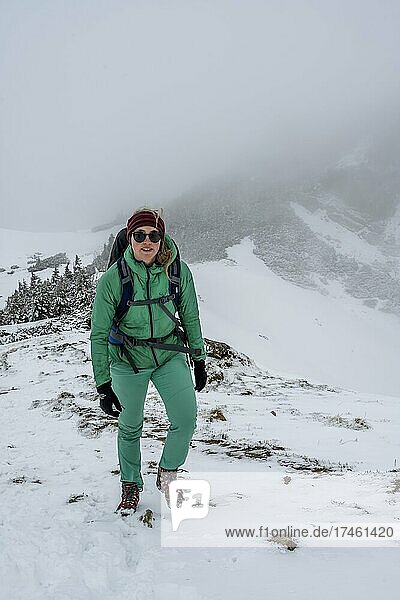 Hiker in the snow  hiking on the Geigelstein  Chiemgau Alps  Bavaria  Germany  Europe