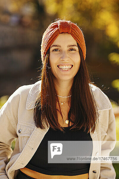 Happy young woman with knit hat and jacket