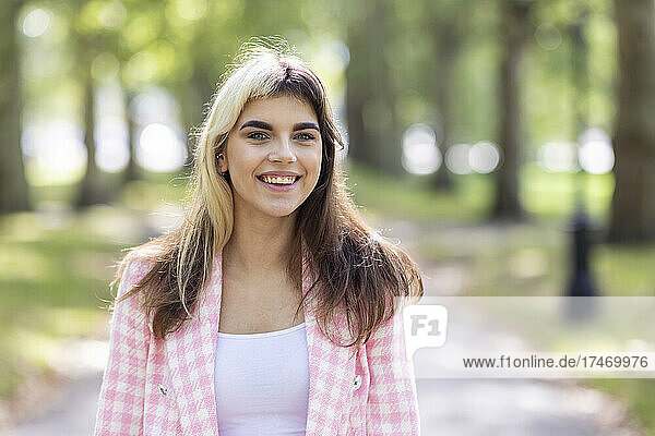 Beautiful woman smiling in public park