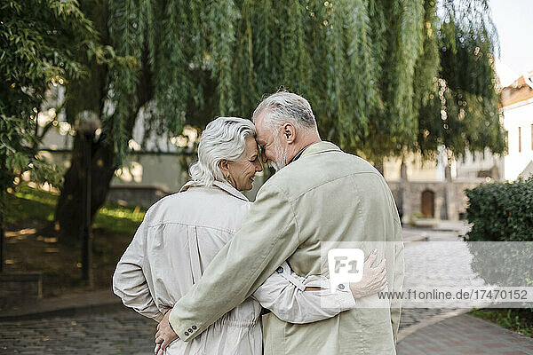 Couple with arms around embracing each other