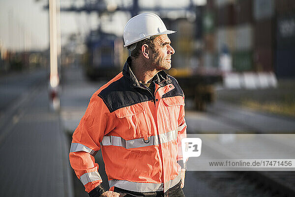 Contemplative male worker at commercial dock