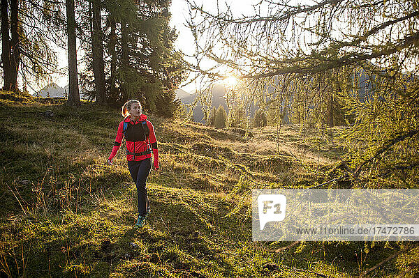 Female hiker walking in forest