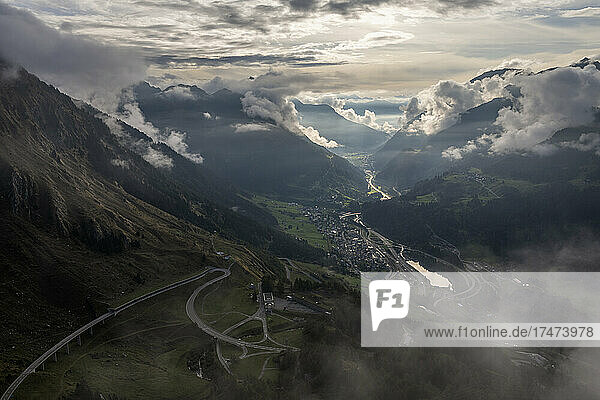 Switzerland  Ticino  Airolo  Dramatic view of Gotthard Pass and mountain village at dusk