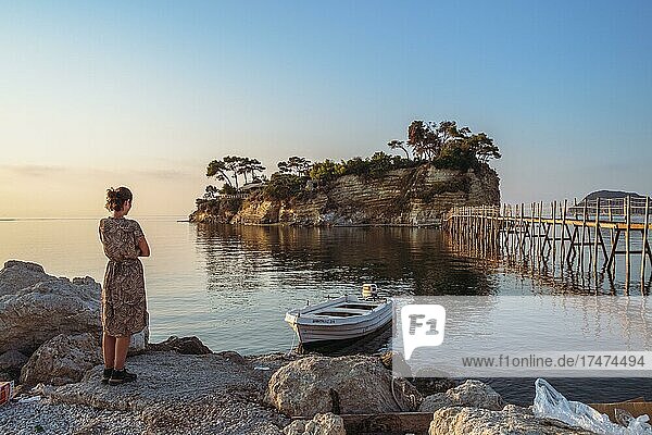 Woman standing in front of Cameo island  Cameo Island  Zakynthos  Greece  Europe