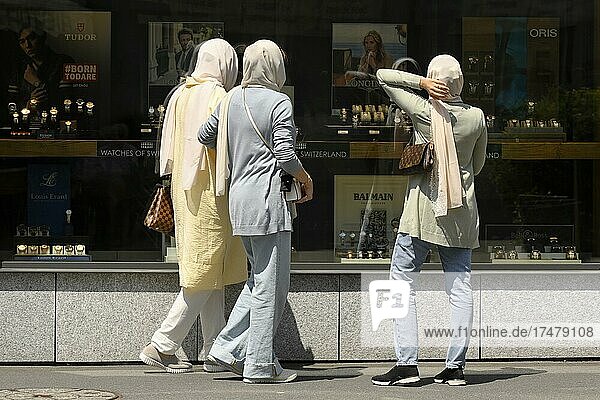 Women with headscarves shopping  Interlaken  Switzerland  Europe