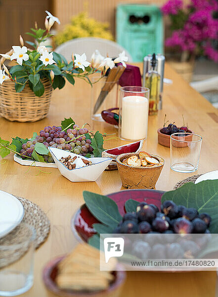 Snacks and flowers on table