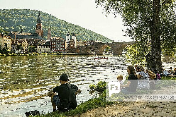 Young people in the evening sun on the Neckar  Heidelberg  Baden-Württemberg  Germany  Europe