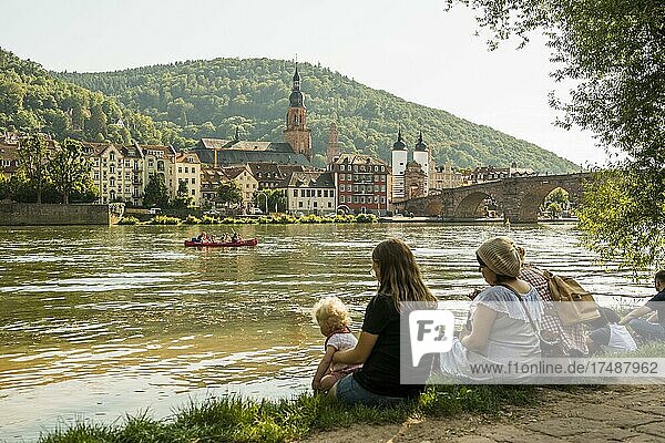 Young people in the evening sun on the Neckar  Heidelberg  Baden-Württemberg  Germany  Europe