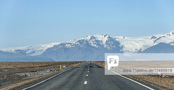 Country road  huge Vatnajökull glacier in the back  Ring Road  Iceland  Europe