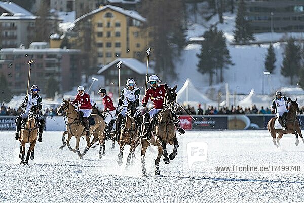 Nacho Gonzalez (red) of Team St. Moritz pursued by opponents from Team Azerbaijan Land of Fire  36th Snow Polo World Cup St. Moritz 2020  Lake St. Moritz  St. Moritz  Grisons  Switzerland  Europe