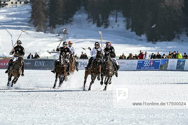 Players from Team Maserati (white) and players from Team Badrutt's Palace Hotel (black) fight hard for the ball  36th Snow Polo World Cup St. Moritz 2020  Lake St. Moritz  St. Moritz  Grisons  Switzerland  Europe