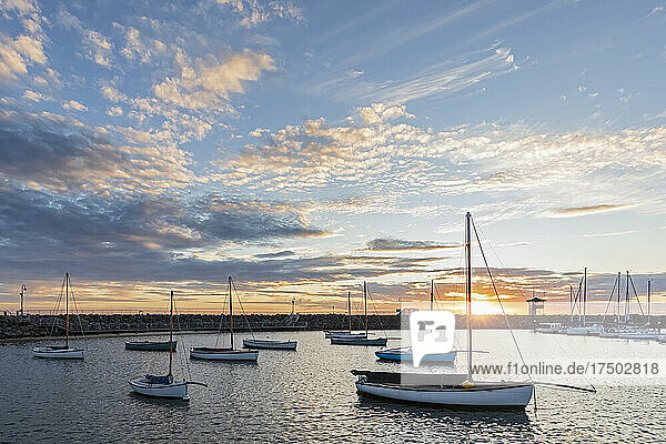 Australia  Victoria  Melbourne  Clouds over yachts floating in Royal Melbourne Yacht Squadron marina at sunset