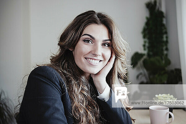 Beautiful businesswoman smiling at office