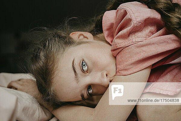 Girl with gray eyes in bedroom at home