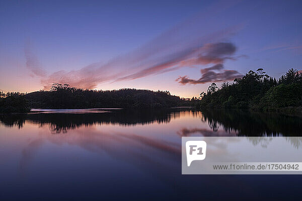 Long exposure of Lake Mangamahoe at purple dawn
