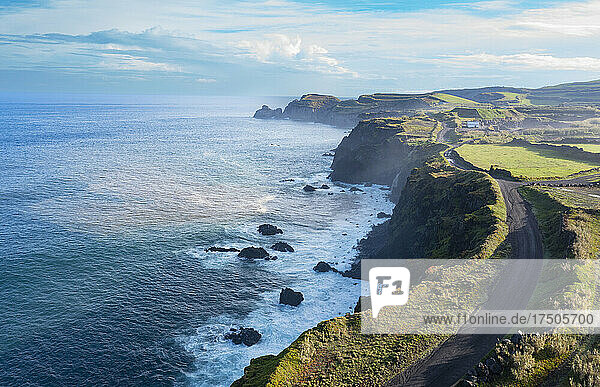 Portugal  Azores  Ribeira Grande  Drone view of dirt road stretching along edge of Sao Miguel Island
