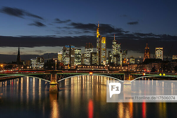 Germany  Hesse  Frankfurt  Ignatz Bubis Bridge at night with illuminated downtown skyline in background