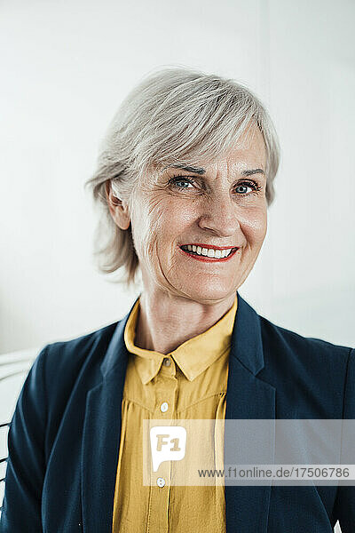 Smiling senior businesswoman at office