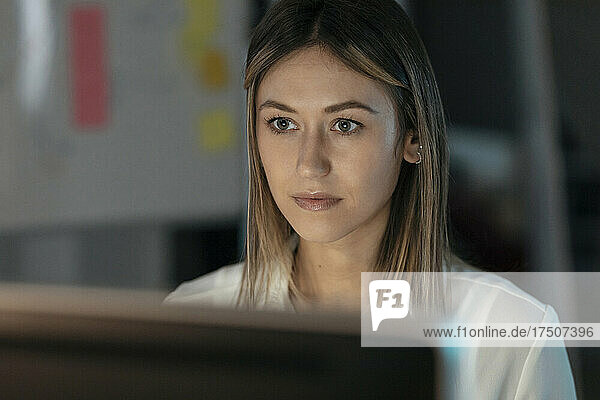 Beautiful businesswoman working on laptop in office