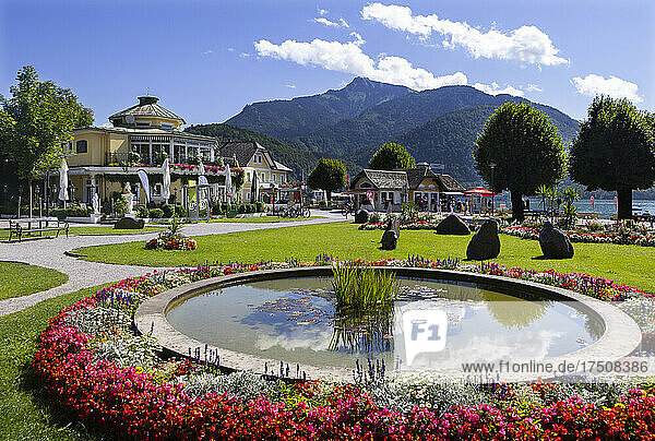 Austria  Salzburg  Saint Gilgen  Pond surrounded by blooming flowers in public park