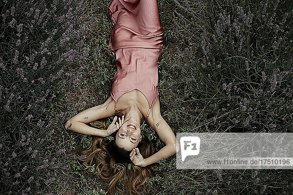 Woman lying in lavender field