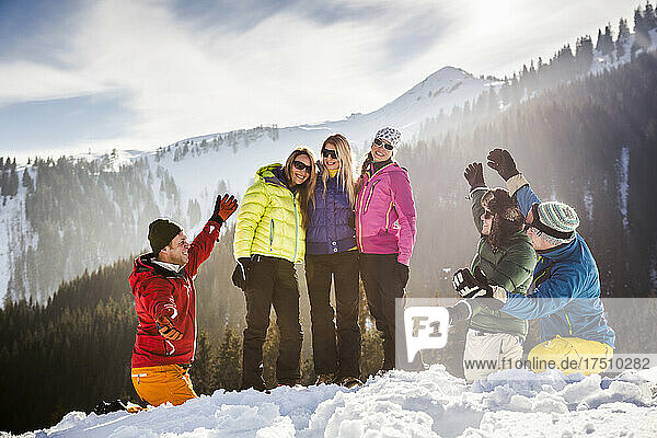 Group of carefree friends having fun in snow  Achenkirch  Austria