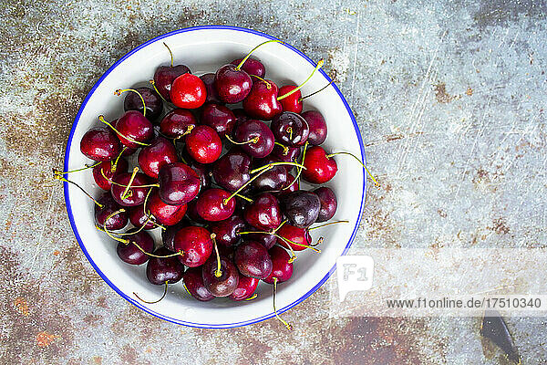 Cherries in enamel bowl