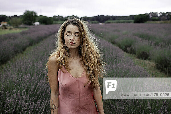 Woman standing in lavender field