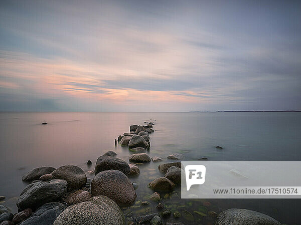 Germany  Mecklenburg-Western Pomerania  Rocky shore of Rugen island at dusk