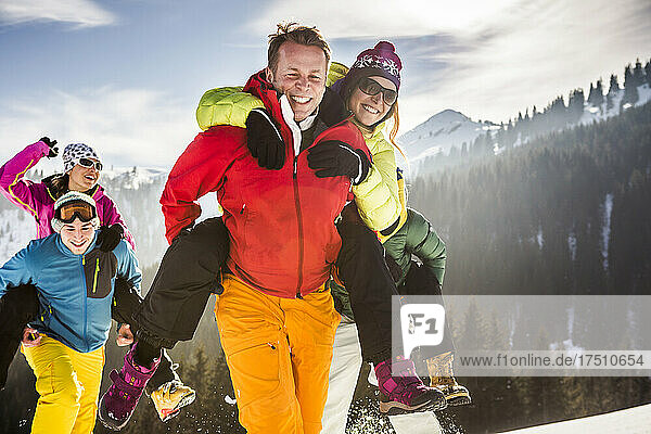 Group of carefree friends having fun in snow  Achenkirch  Austria