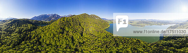 Germany  Bavaria  Fussen  Drone view of Weissensee lake and forested Tannheim Mountains in summer