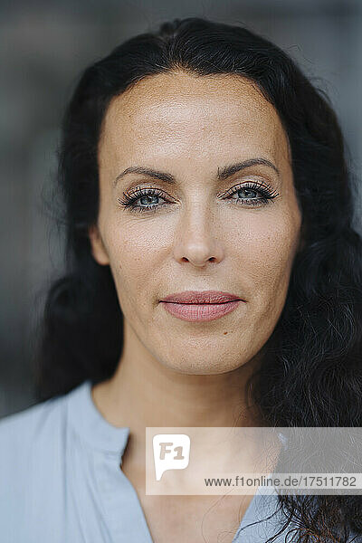 Close-up portrait of beautiful woman with gray eyes