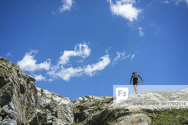 Man hiking on top of mountain at Western Rhaetian Alps  Sondrio  Italy