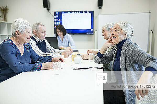 Group of active seniors attending seniors education course