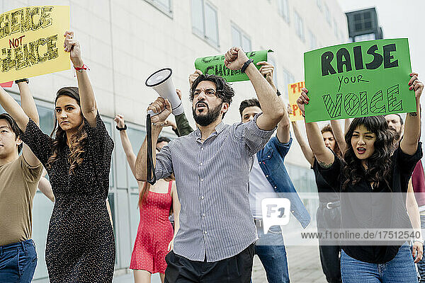 Multi ethnic activists protesting in city