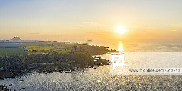UK  Scotland  North Berwick  Aerial view of shore of Firth of Forth and ruins of Tantallon Castle at sunset