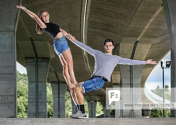 Young couple doing acrobatics