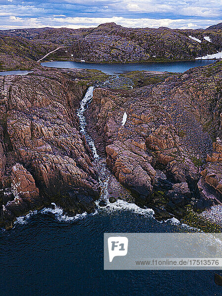 Russia  Murmansk Oblast  Teriberka  Aerial view of waterfall at coast of Barents Sea