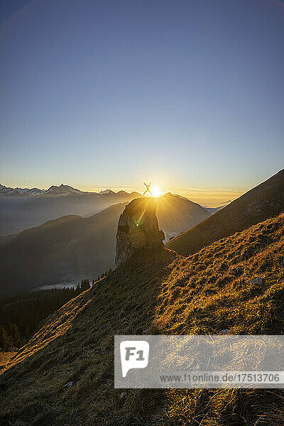 Hiker on viewpoint during sunset  Aggenstein  Bavaria  Germany
