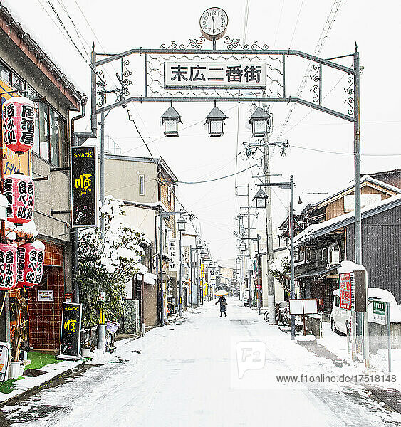 Woman exploring the town of Takayama in the winter
