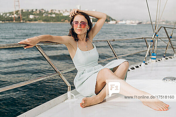 Woman sitting on the yacht deck