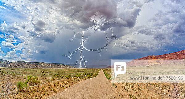 Lightning storm rolling across House Rock Valley Road on the west side of Vermilion Cliffs National Monument  Arizona  United States of America  North America
