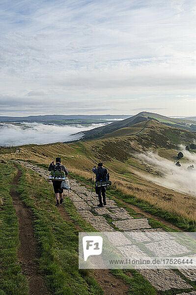 Hikers on The Great Ridge with cloud inversion  Edale  The Peak District  Derbyshire  England  United Kingdom  Europe